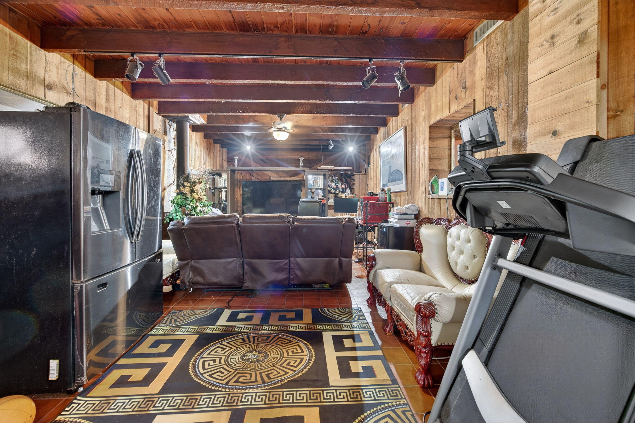 9281 Martinique Drive Miami, FL 33189 - Photo 9 of 35 a living room with furniture flat screen tv and a fireplace