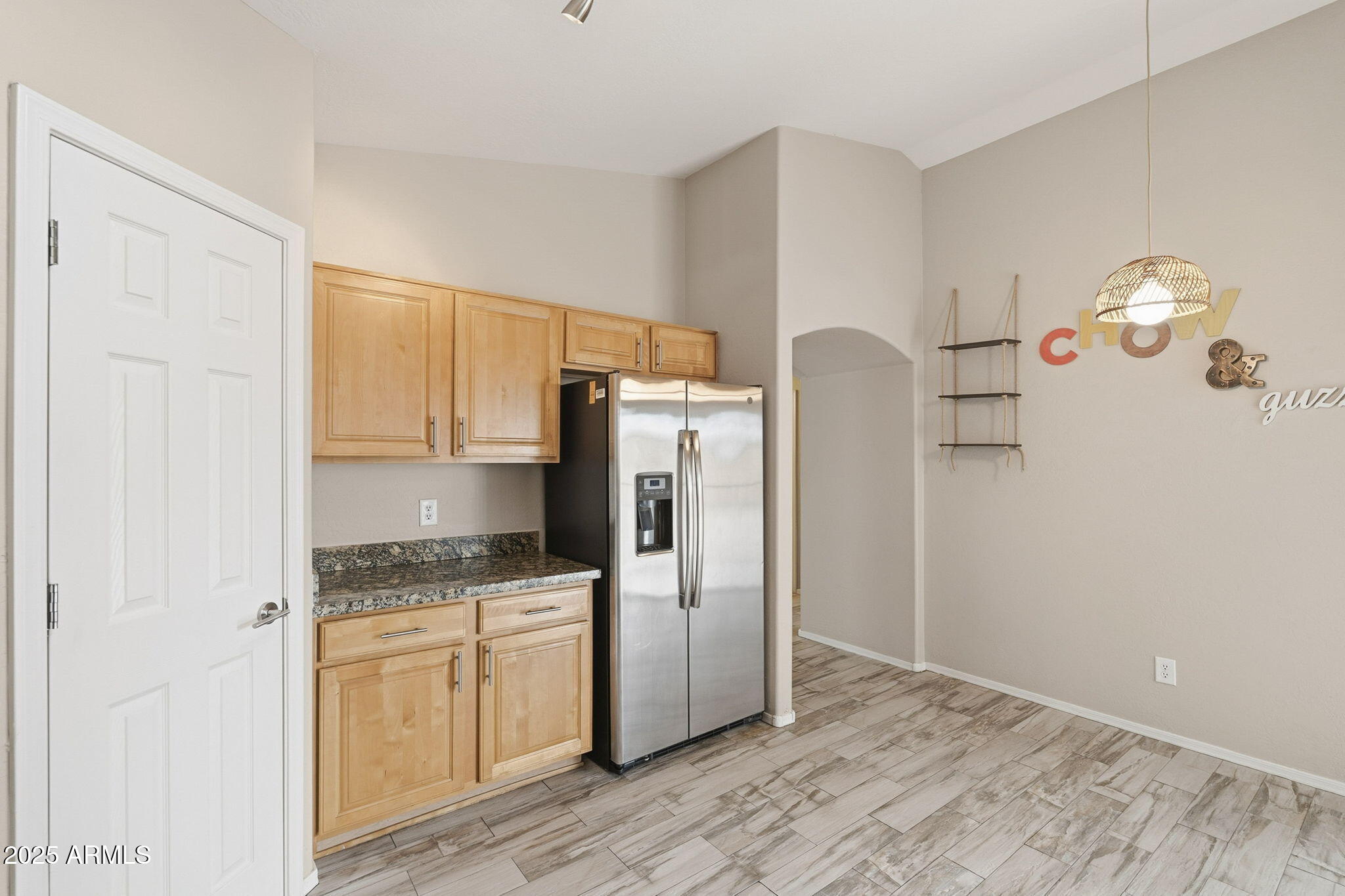 227 South 16th Street Coolidge, AZ 85128 - Photo 14 of 34 a kitchen with stainless steel appliances granite countertop a refrigerator and a stove top oven