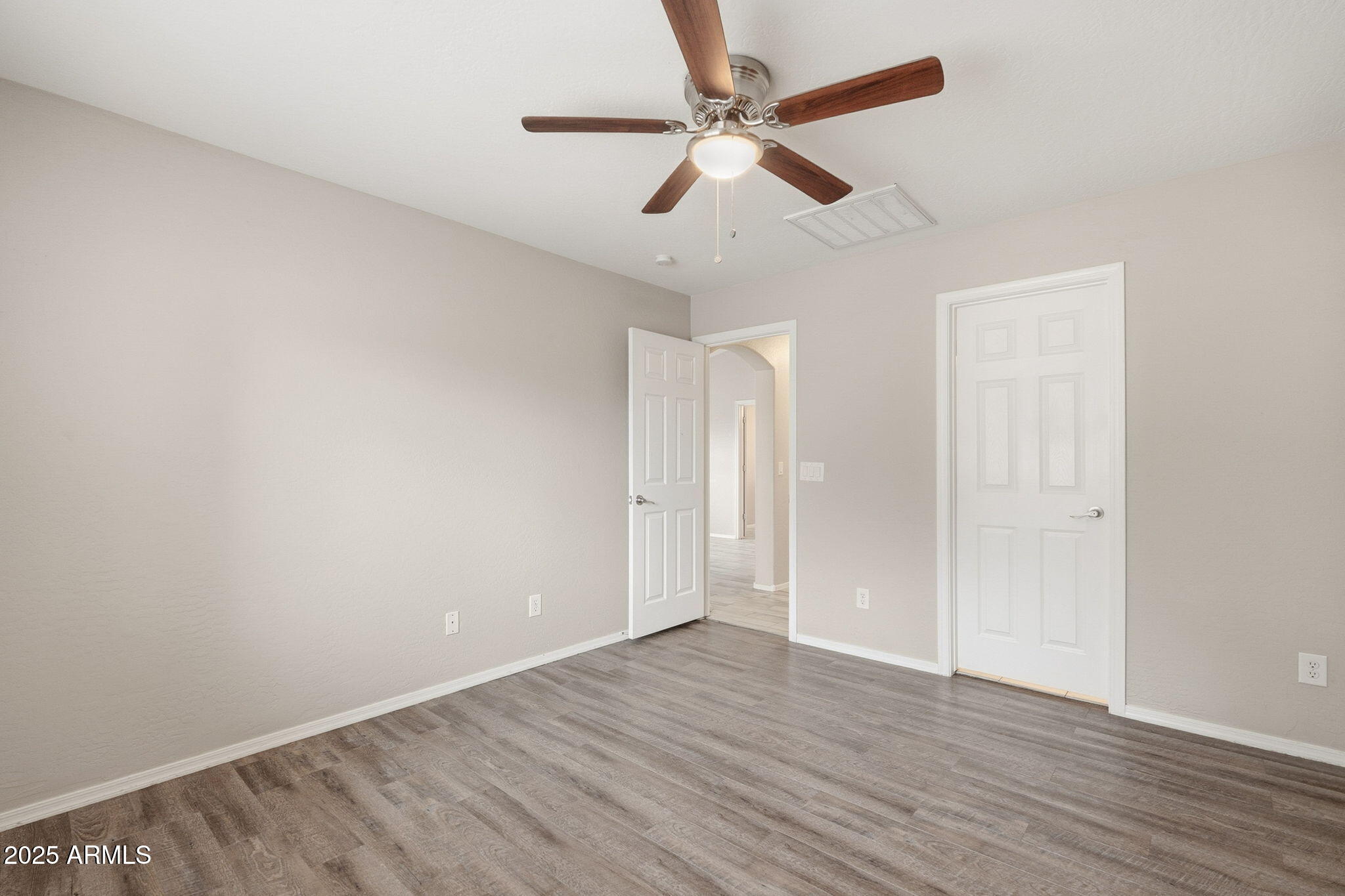 227 South 16th Street Coolidge, AZ 85128 - Photo 19 of 34 wooden floor in an empty room