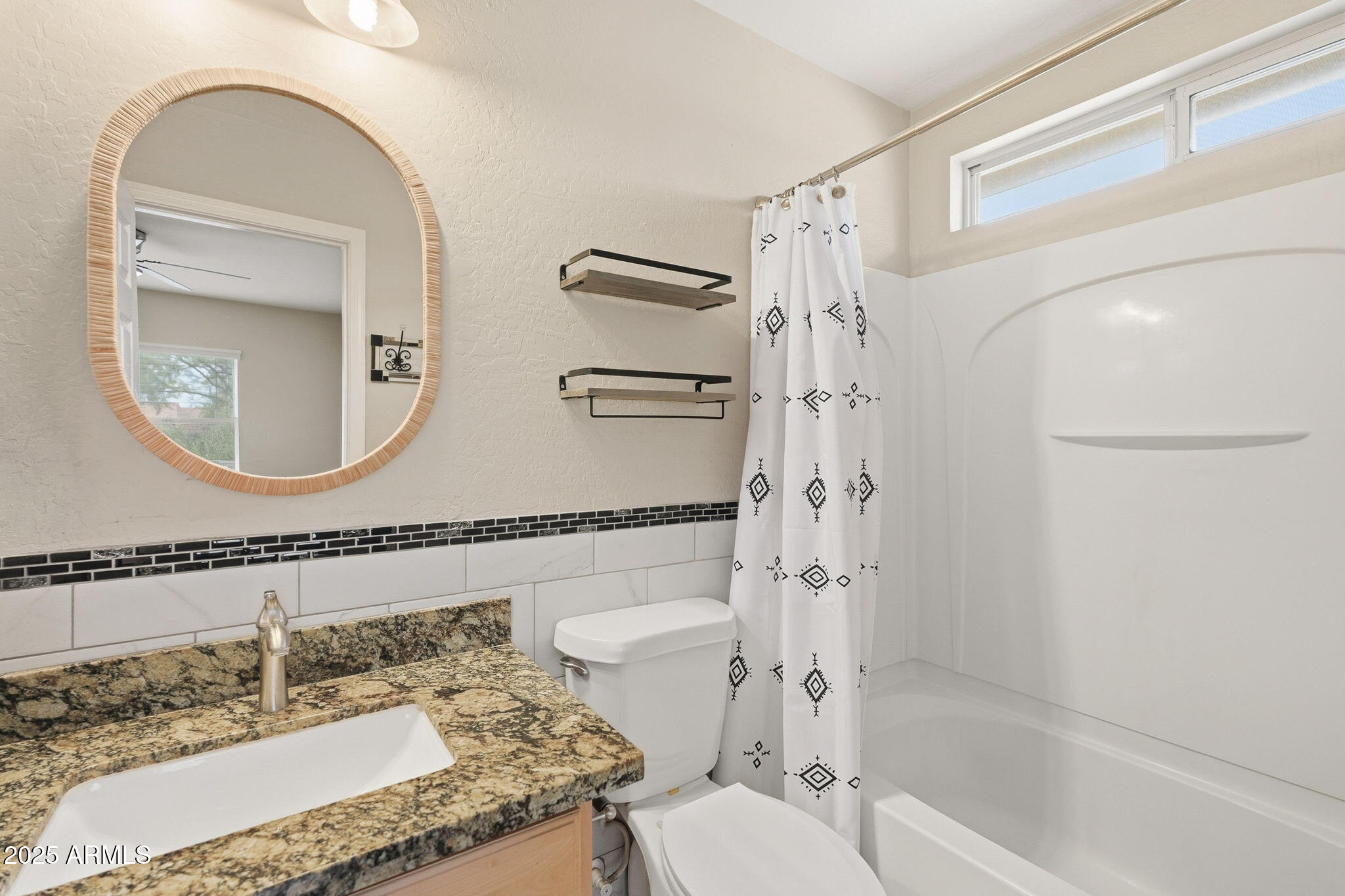 227 South 16th Street Coolidge, AZ 85128 - Photo 21 of 34 a bathroom with a granite countertop sink mirror vanity and toilet