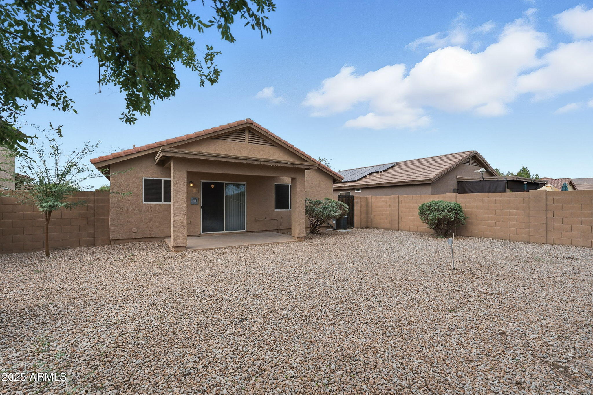 227 South 16th Street Coolidge, AZ 85128 - Photo 29 of 34 a front view of a house with a yard and garage