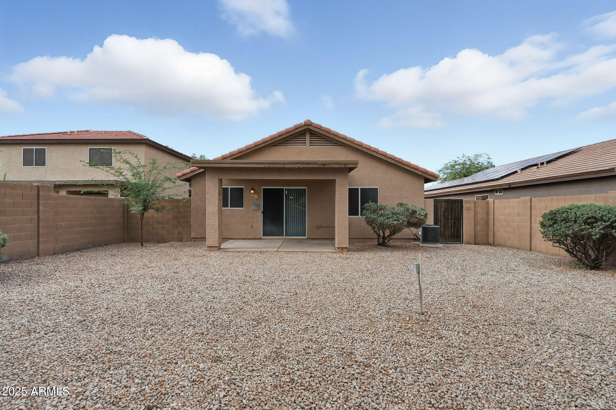 227 South 16th Street Coolidge, AZ 85128 - Photo 30 of 34 a front view of a house with a yard and garage