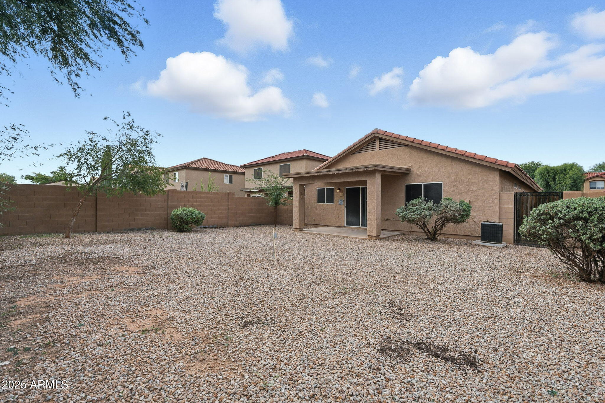 227 South 16th Street Coolidge, AZ 85128 - Photo 31 of 34 a view of a house with a yard and potted plants