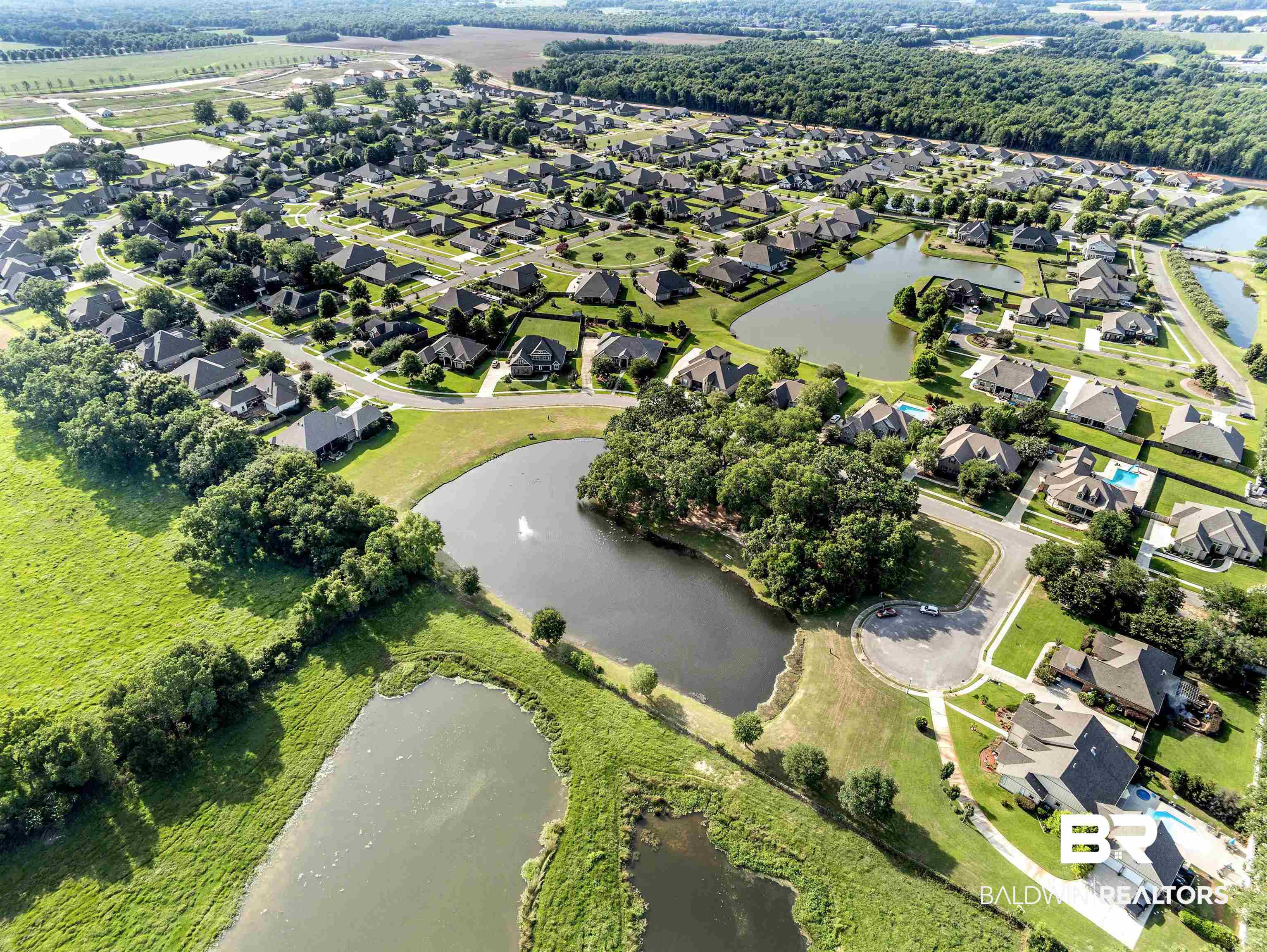 24479 Kipling Court Daphne, AL 36526 - Photo 39 of 41 Aerial overview of property's location with nearby suburban area and a large body of water