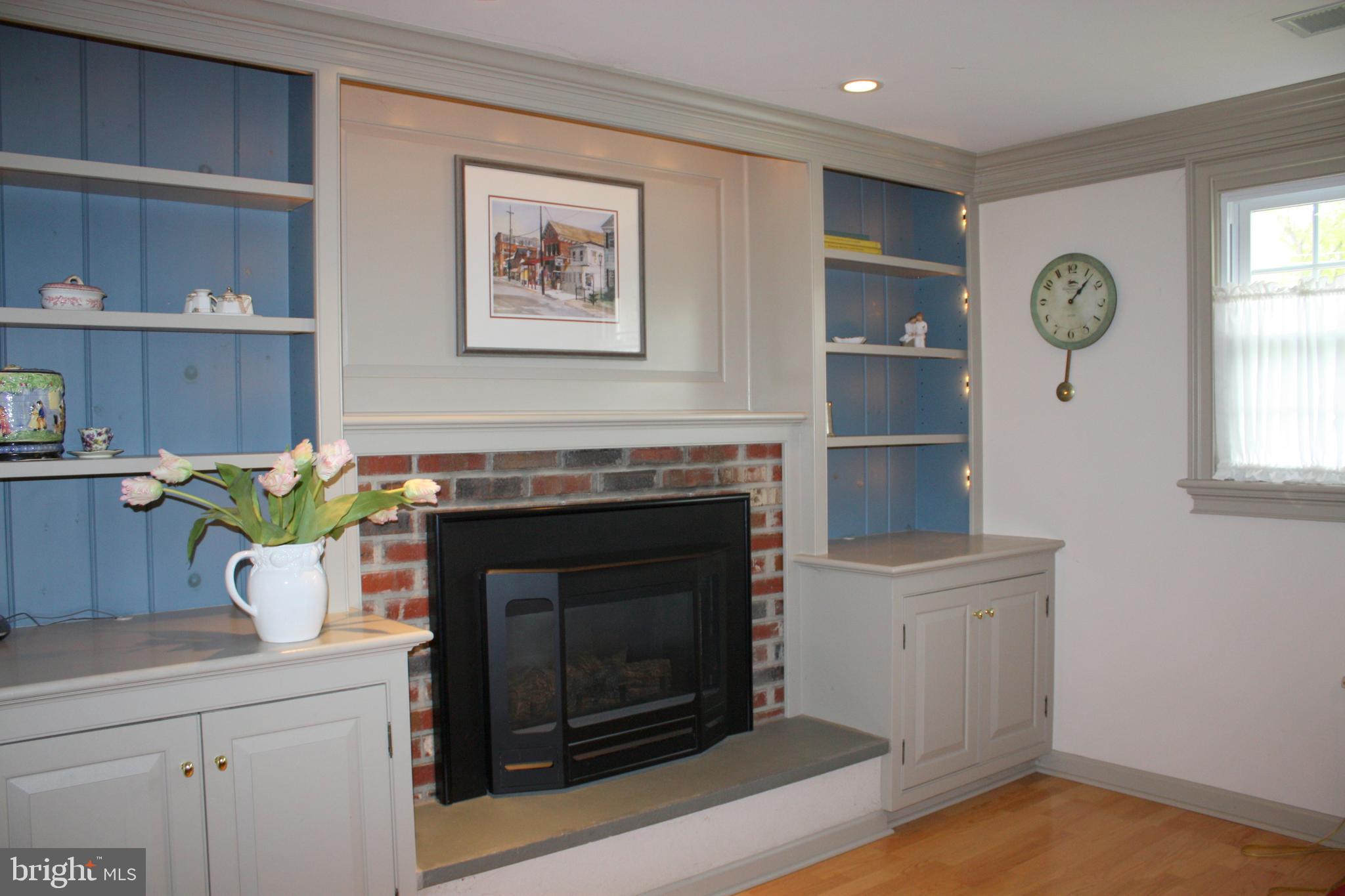 1132 Banes Road Southampton, PA 18966 - Photo 22 of 25 Gas fireplace with built-in shelving and cabinets