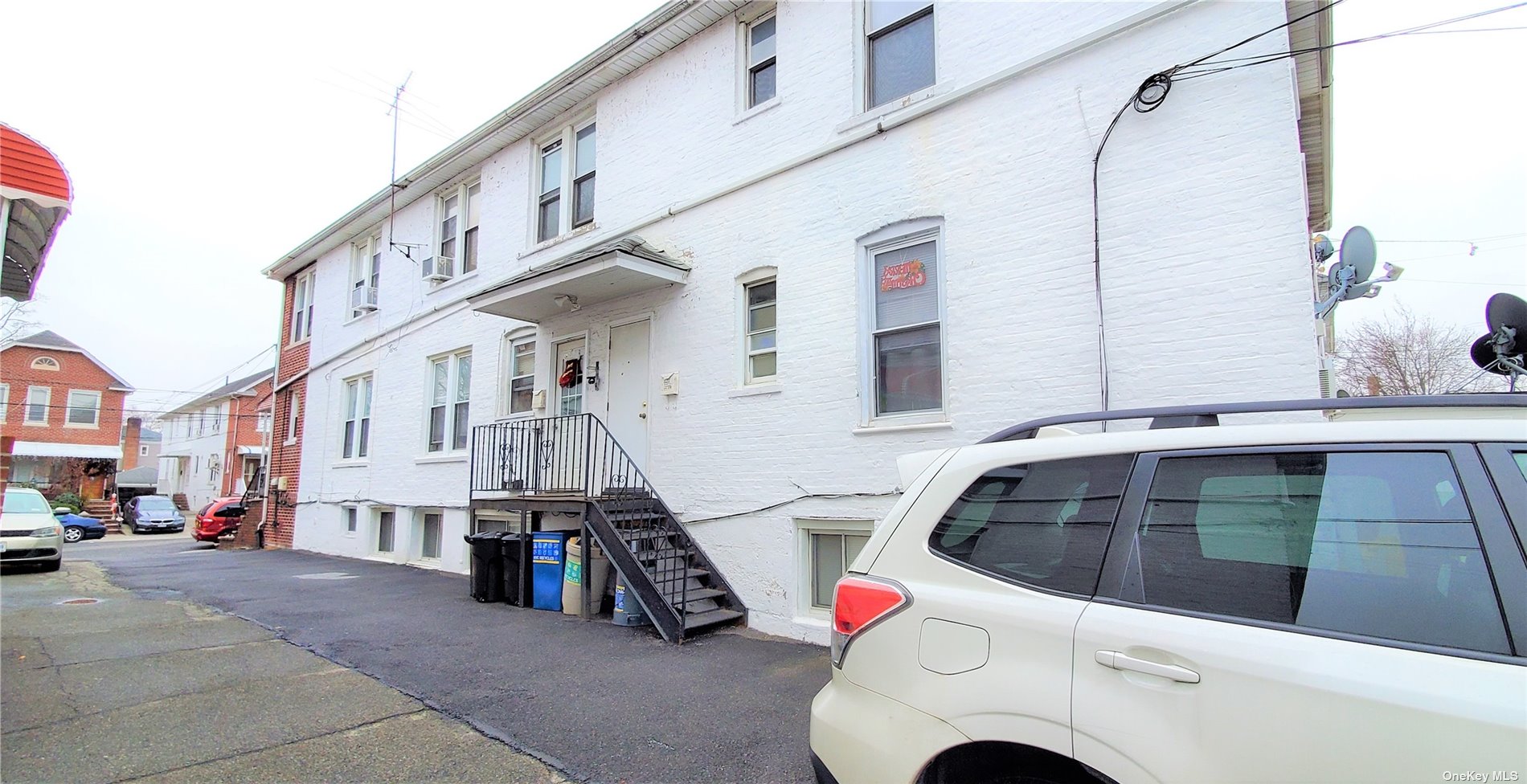 39-10 201st Street Queens, NY 11361 - Photo 8 of 9 a view of a street with cars