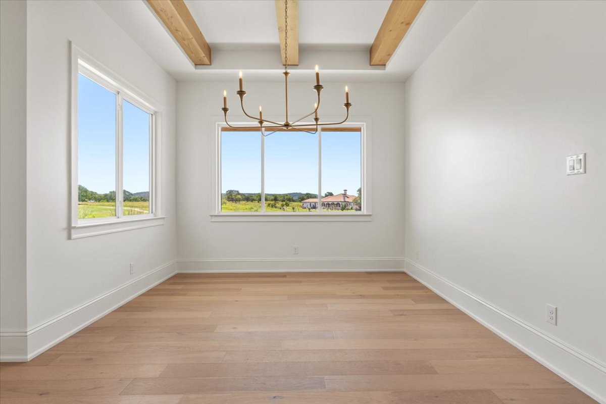 224 Sandia Loop Kingsland, TX 78639 - Photo 10 of 32 an empty room with ceiling fan and window