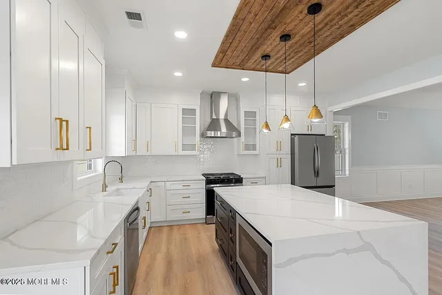 a kitchen with a sink a stove and refrigerator