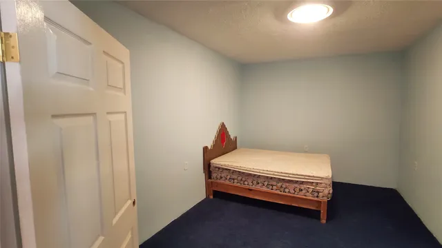 a room with a bed and a window