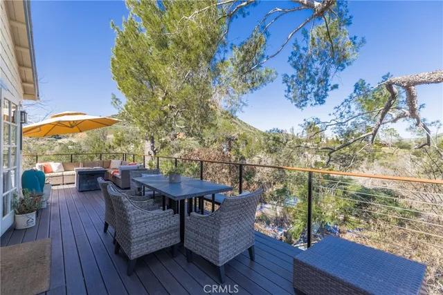 an outdoor space with furniture and umbrella