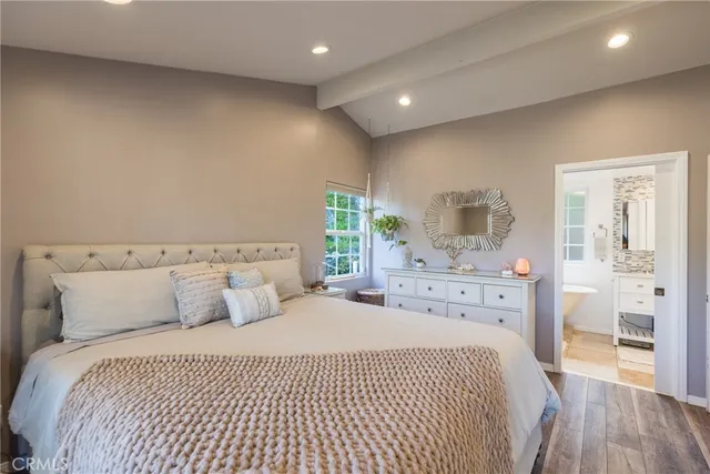 a bedroom with a bed and a dresser