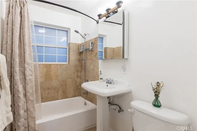 a view of a patio with chairs and plants