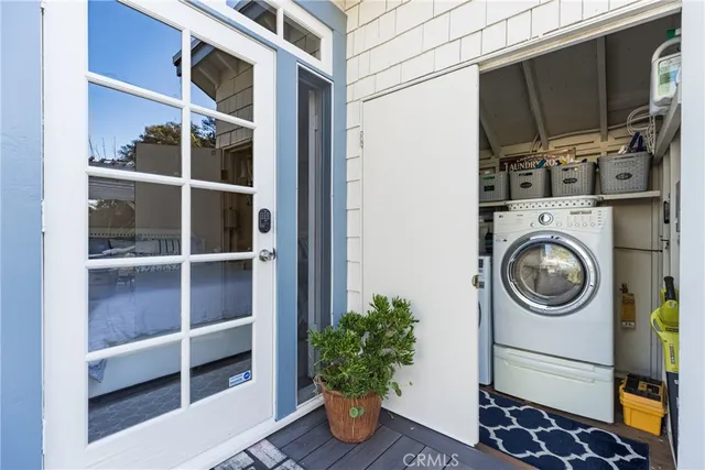 a view of a chairs and table in the backyard