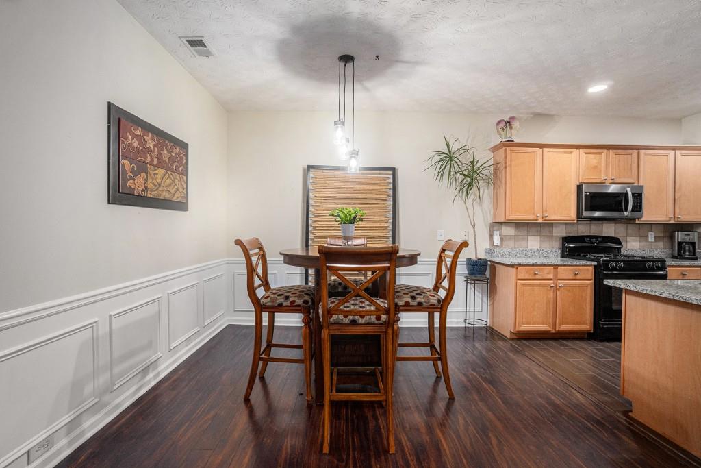 771 Nehemiah Lane Atlanta, GA 30331 - Photo 11 of 30 a view of a dining room with furniture window and wooden floor