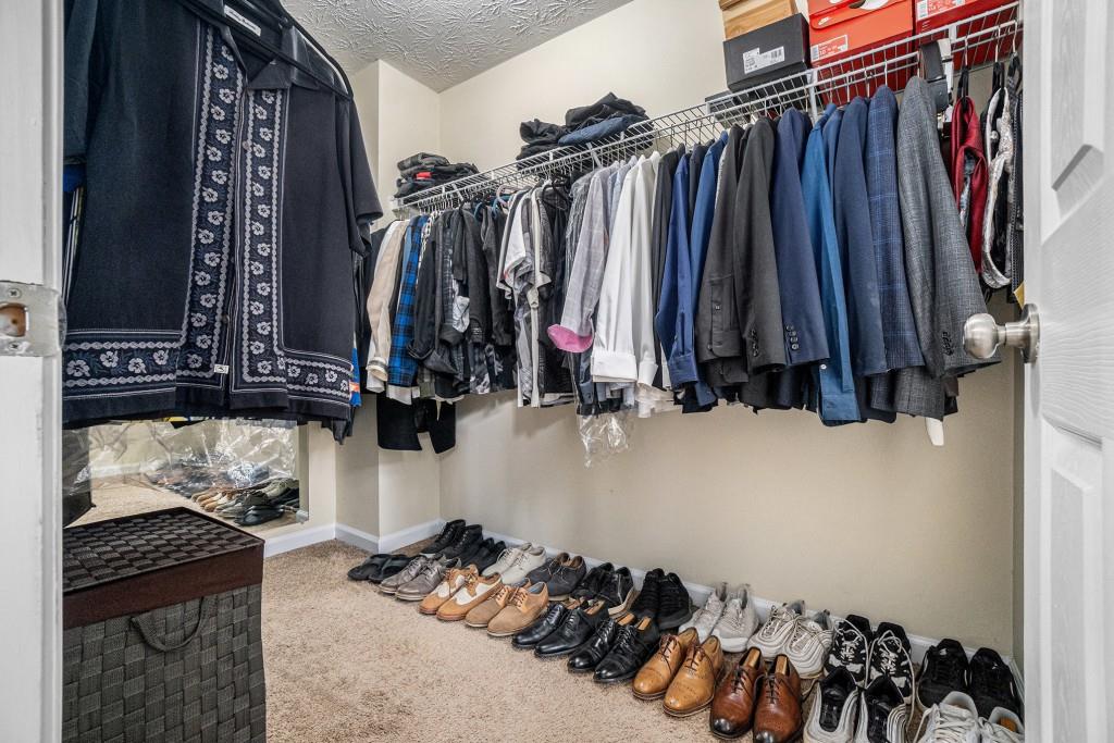771 Nehemiah Lane Atlanta, GA 30331 - Photo 20 of 30 a view of walk in closet with clothes and shoes