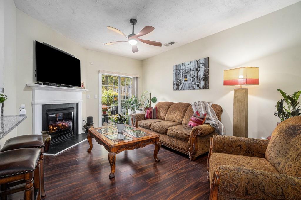 771 Nehemiah Lane Atlanta, GA 30331 - Photo 2 of 30 a living room with furniture fireplace and a flat screen tv