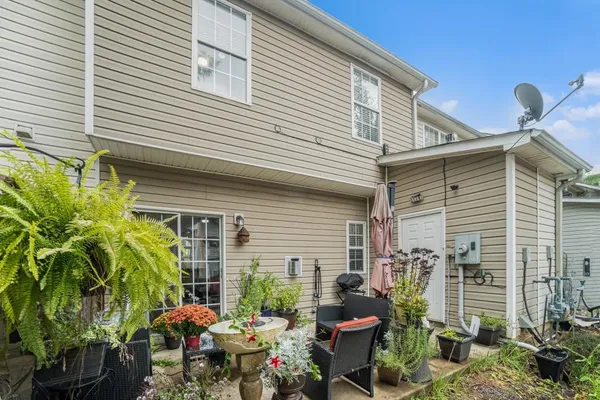 a view of a house with patio and plants