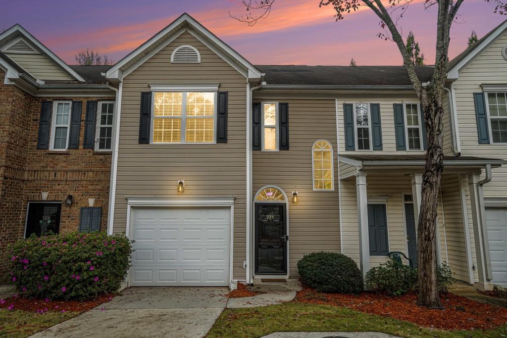 771 Nehemiah Lane Atlanta, GA 30331 - Photo 28 of 30 a front view of a house with a yard and garage