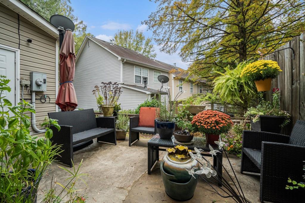 771 Nehemiah Lane Atlanta, GA 30331 - Photo 6 of 30 a view of a patio with couches and potted plants