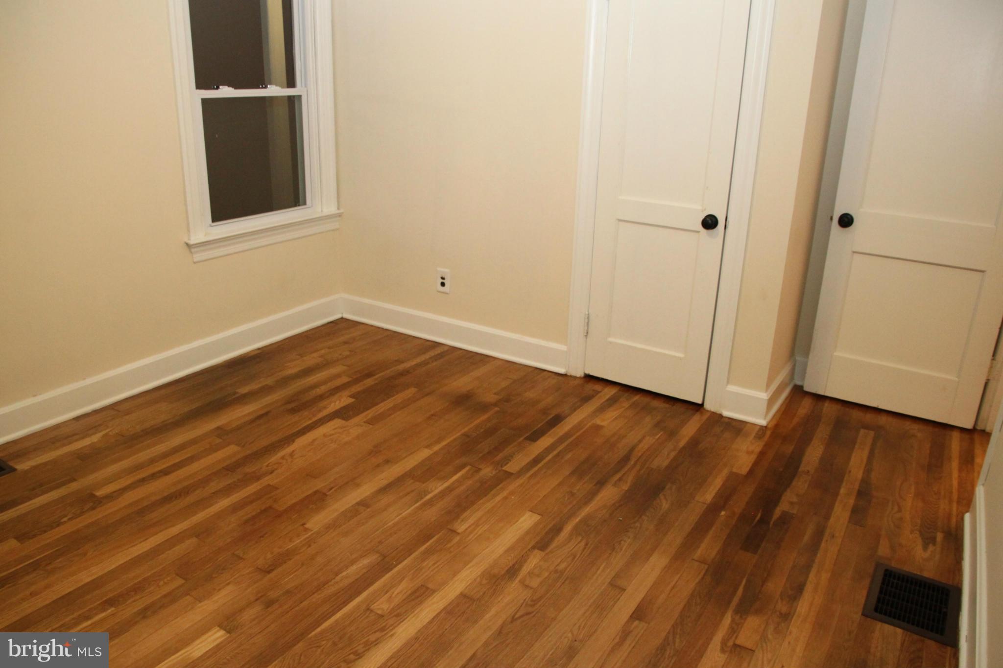 12409 Big Spring Road Clear Spring, MD 21722 - Photo 11 of 20 a view of an empty room with wooden floor and a window