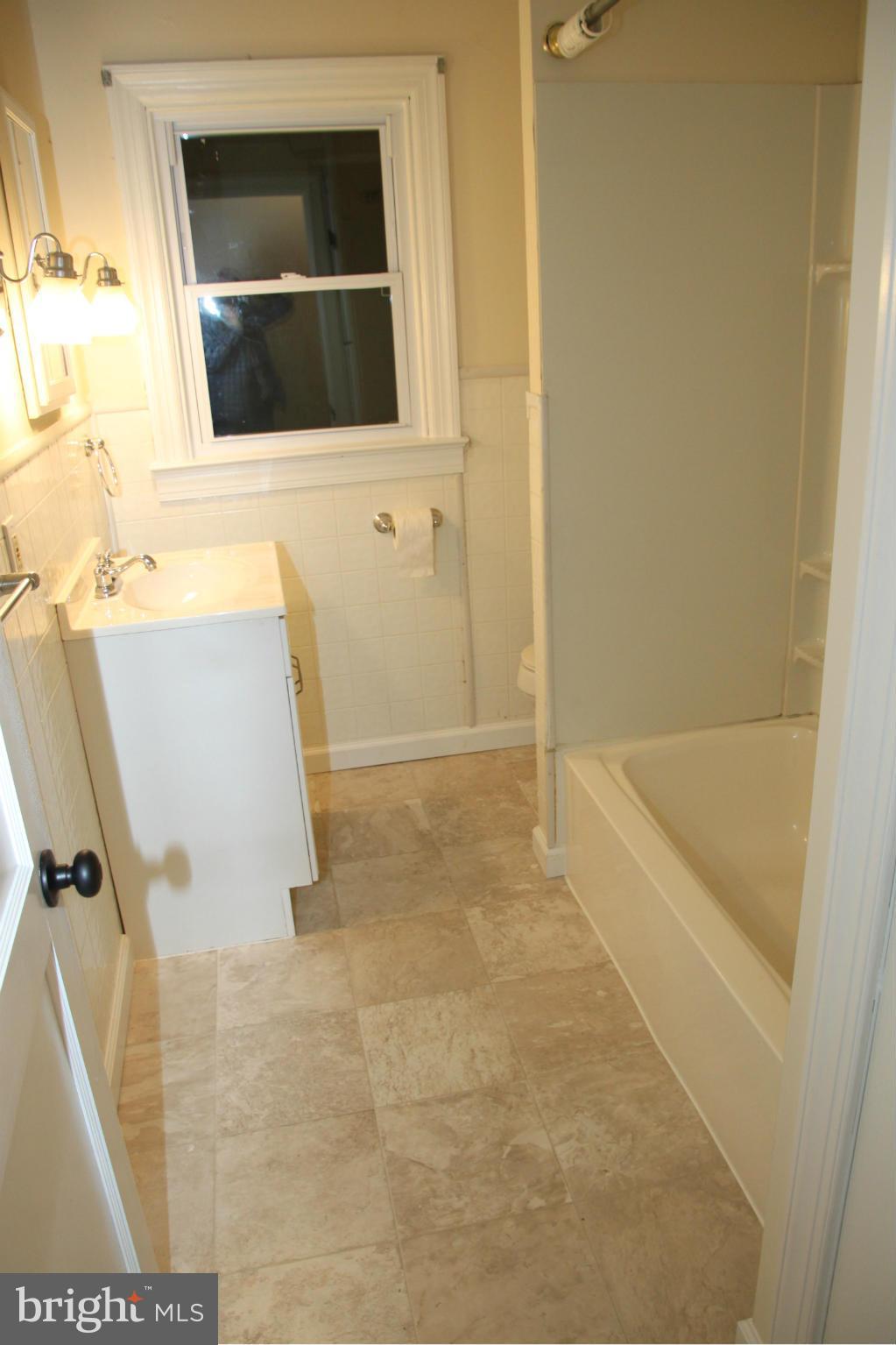 12409 Big Spring Road Clear Spring, MD 21722 - Photo 9 of 20 a bathroom with a tub and a shower