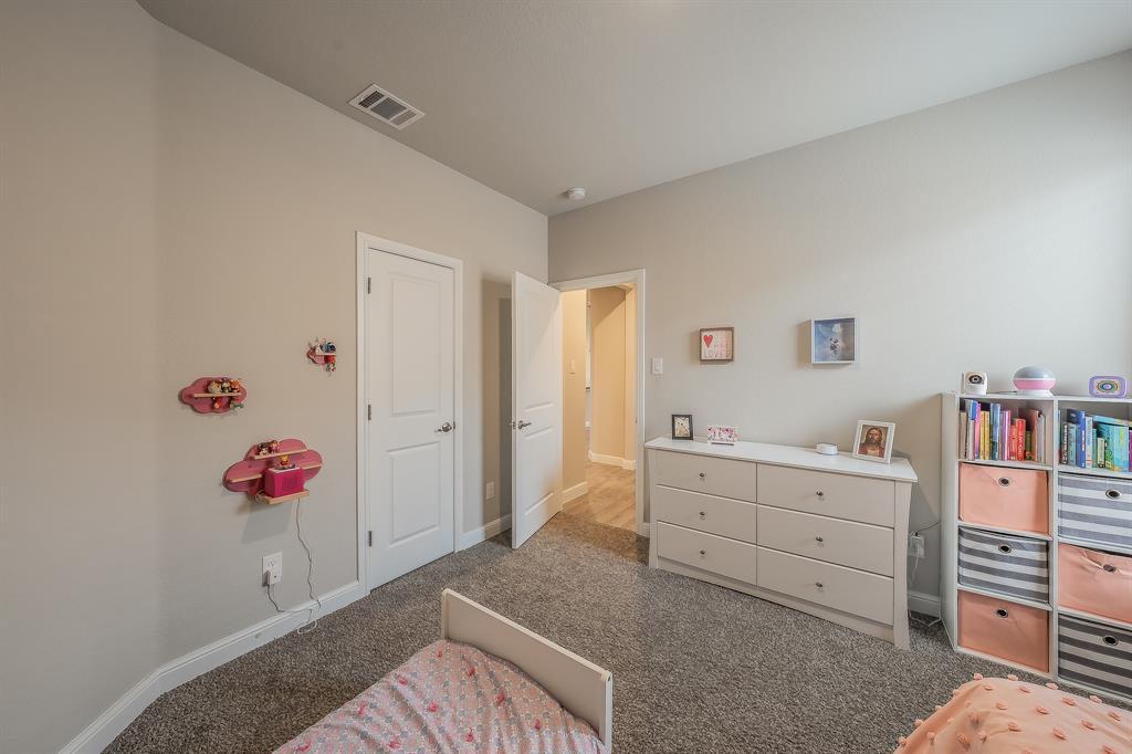 1212 Bosque Lane Weatherford, TX 76087 - Photo 15 of 38 a spacious bedroom with a bed and a window