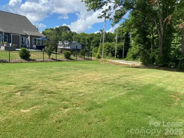 a view of a house with a big yard