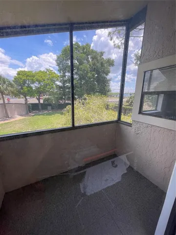 a view of a room with a large window