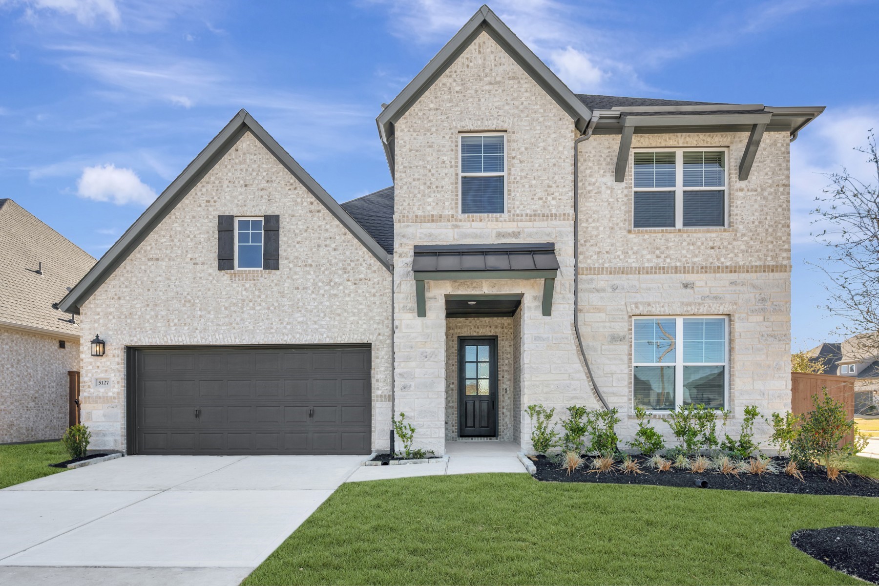 5127 Benton Wds Trail Rosenberg, TX 77471 - Photo 3 of 50 a front view of a house with a garden and garage