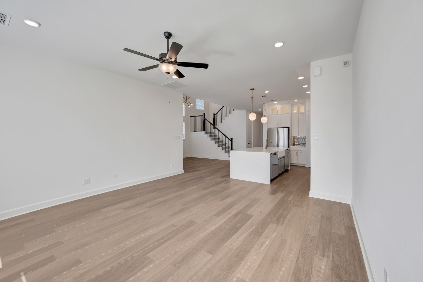 5127 Benton Wds Trail Rosenberg, TX 77471 - Photo 31 of 50 a view of a room with a wooden floor and ceiling fan