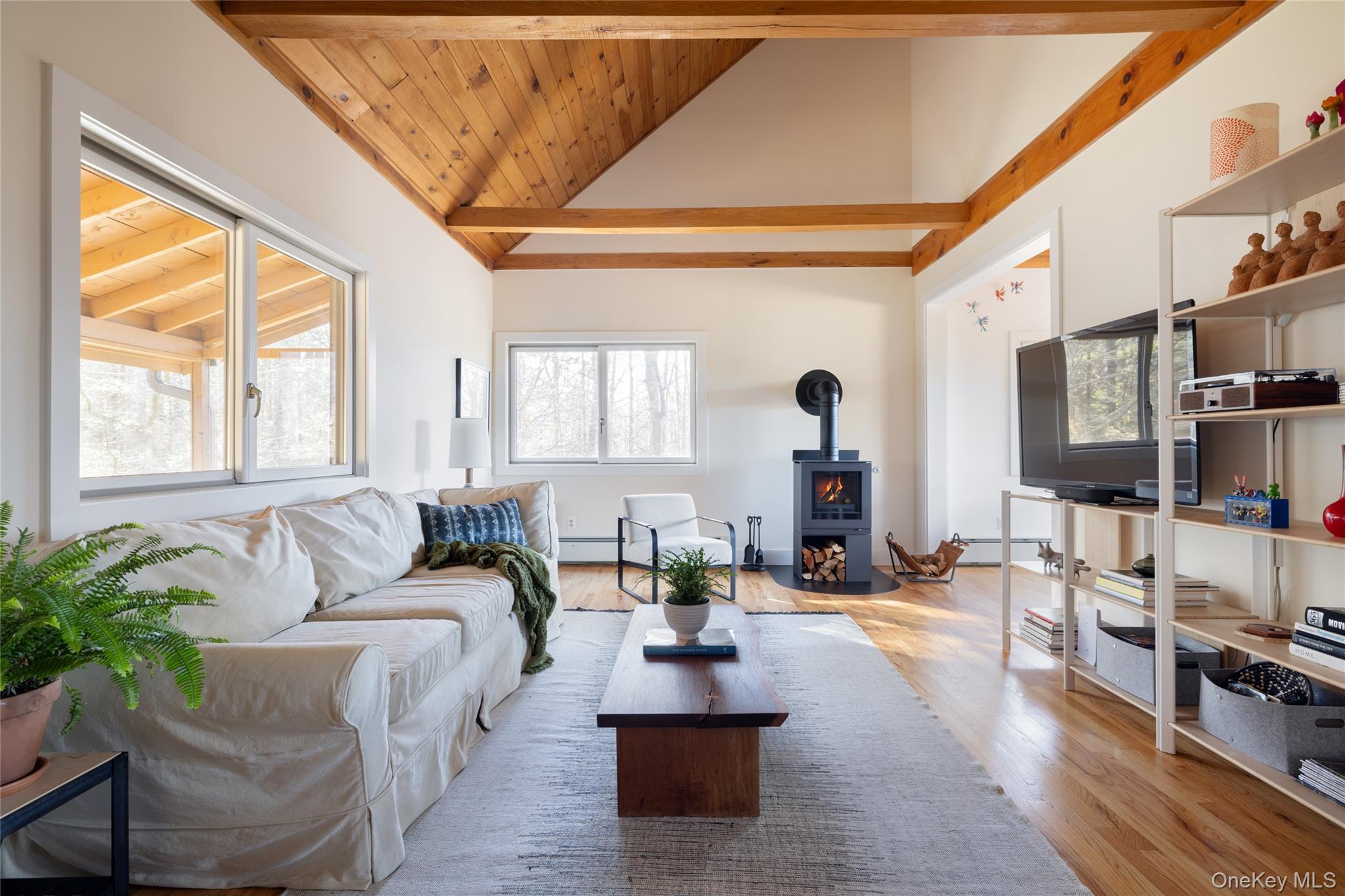 827 Ashokan Road Kingston, NY 12401 - Photo 12 of 36 a living room with furniture large window and wooden floor