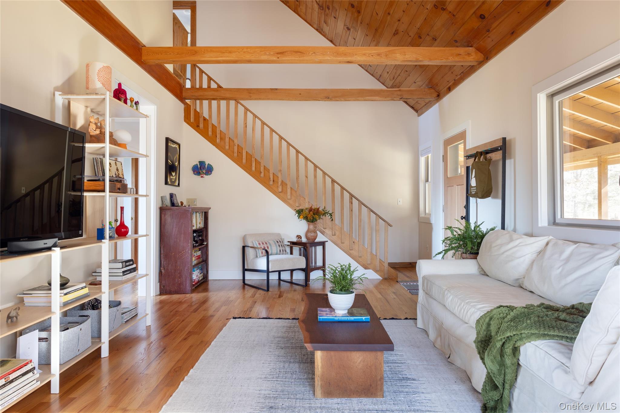 827 Ashokan Road Kingston, NY 12401 - Photo 13 of 36 a living room with furniture and a flat screen tv