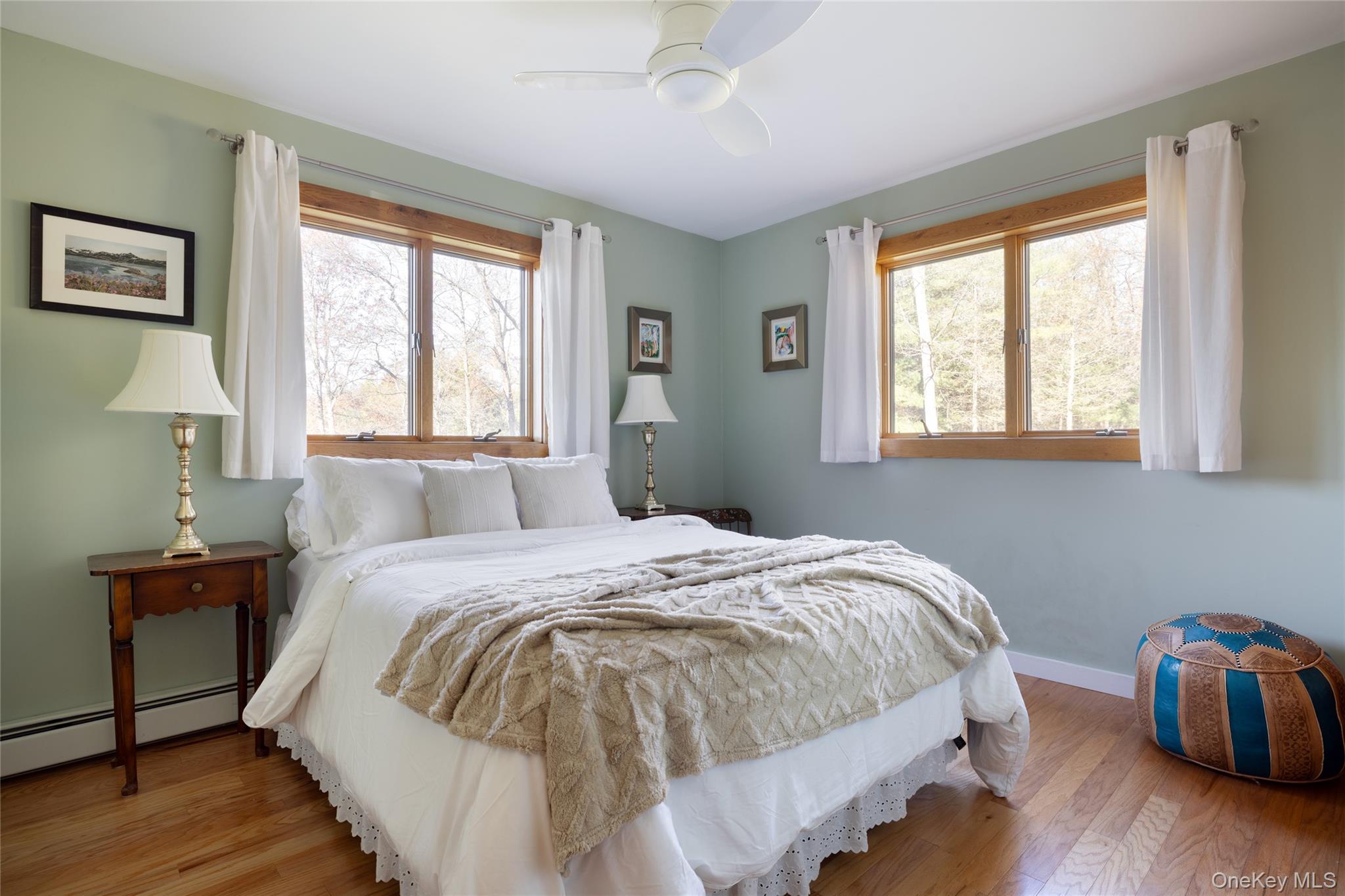 827 Ashokan Road Kingston, NY 12401 - Photo 14 of 36 a bedroom with a bed and wooden floor