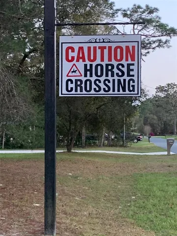 a sign that is on a brick wall