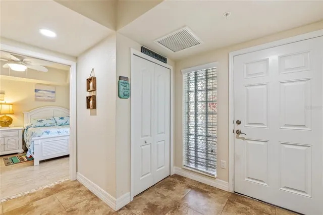 a view of an empty room and bathroom