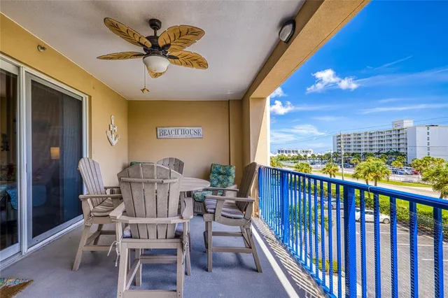 a view of a balcony with furniture