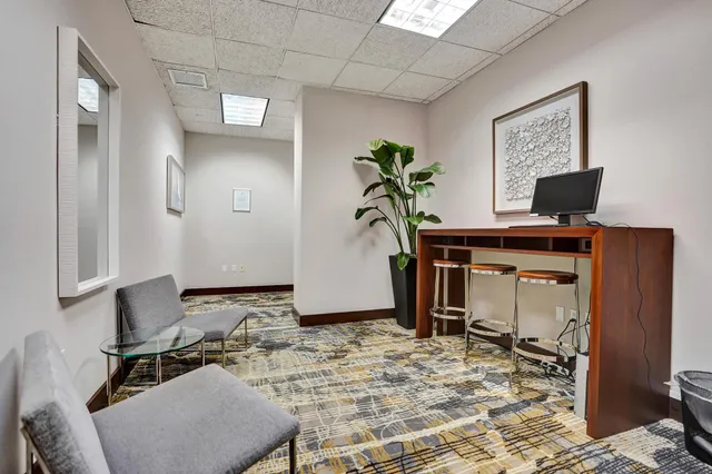 a room with table tennis table and windows