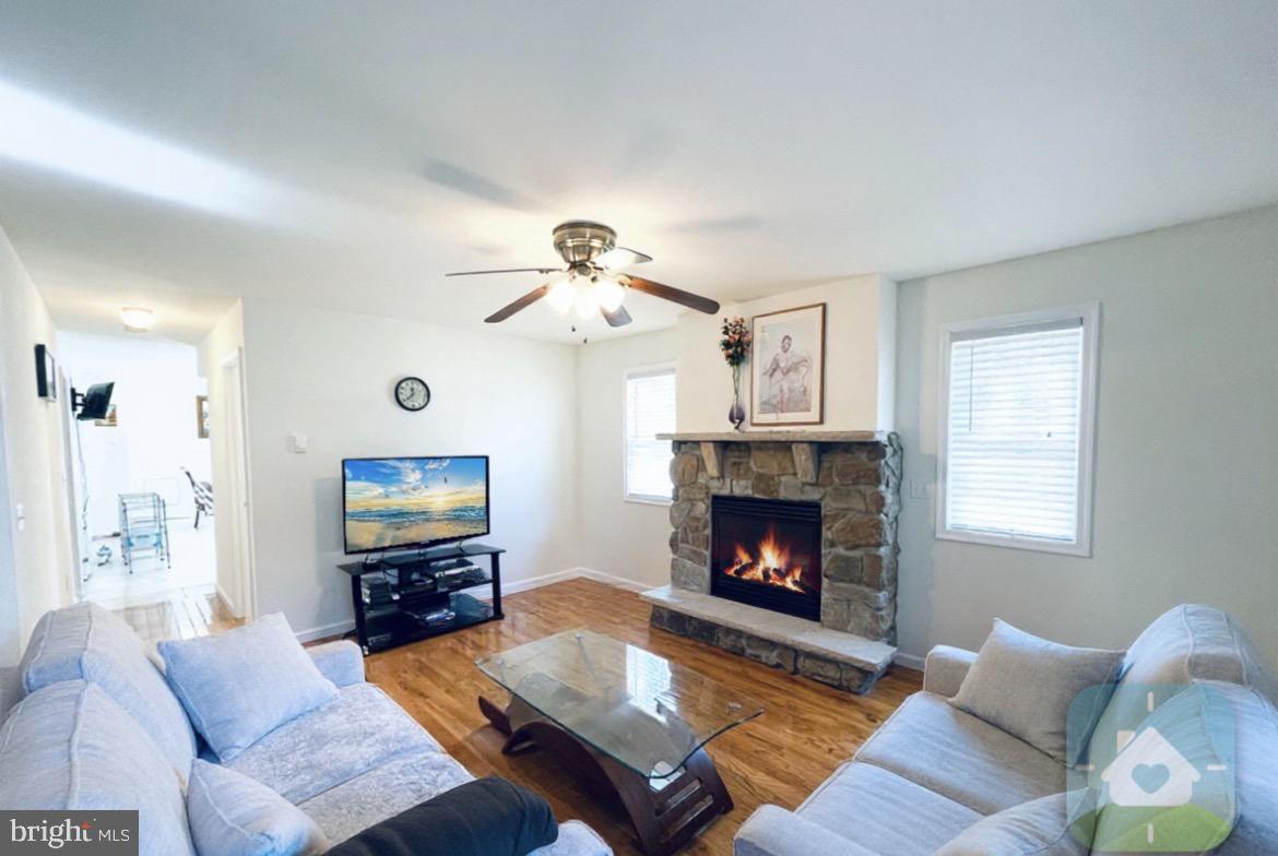 641 Main Washington, NJ 07882 - Photo 4 of 24 a living room with furniture and a fireplace