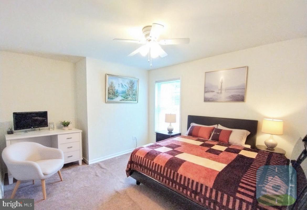 641 Main Washington, NJ 07882 - Photo 7 of 24 a bedroom with a bed and a chandelier