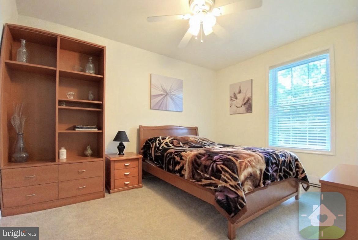 641 Main Washington, NJ 07882 - Photo 9 of 24 a bedroom with a bed and cabinets