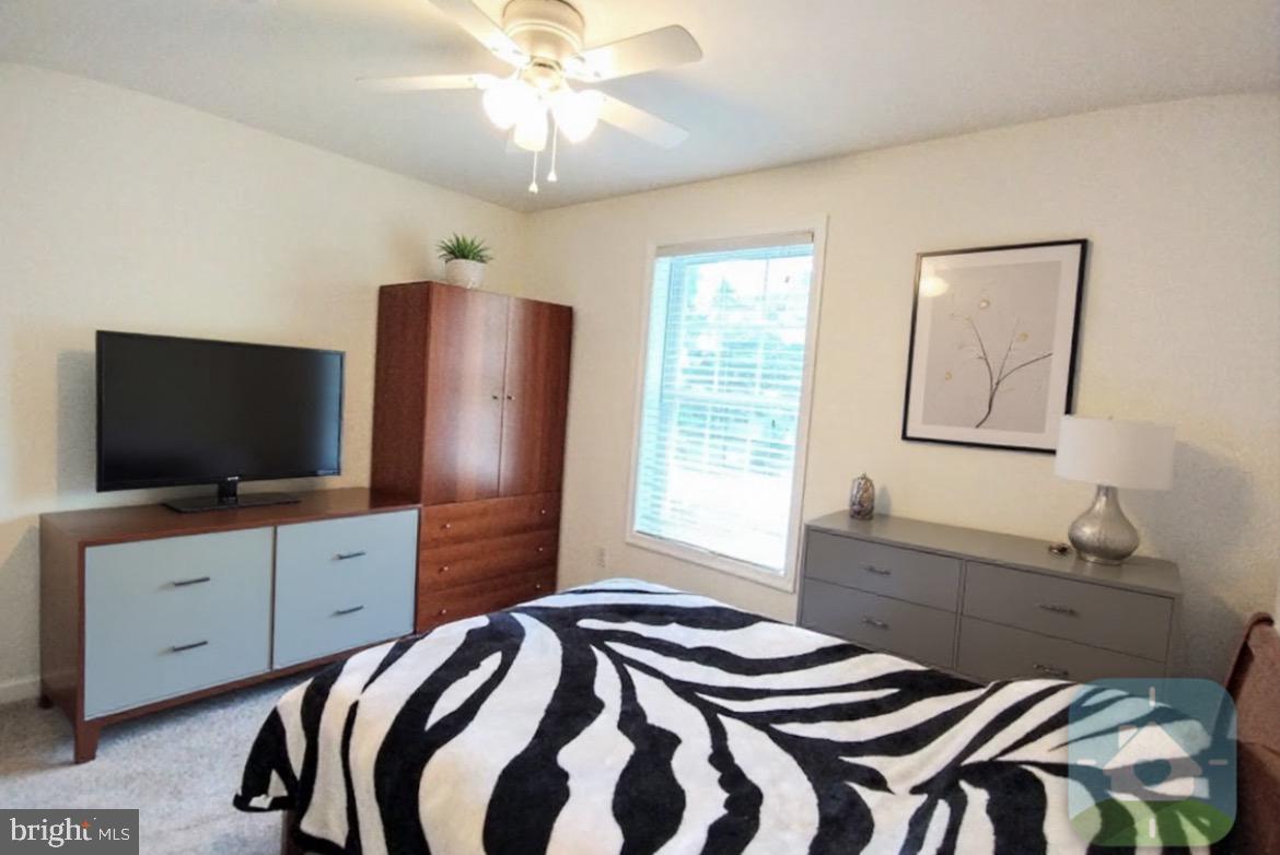 641 Main Washington, NJ 07882 - Photo 10 of 24 a bedroom with a bed and a flat screen tv