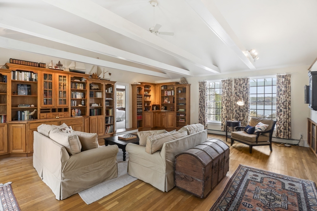 94 Weaver Lane Tisbury, MA 02568 - Photo 17 of 36 a living room with furniture and a large window