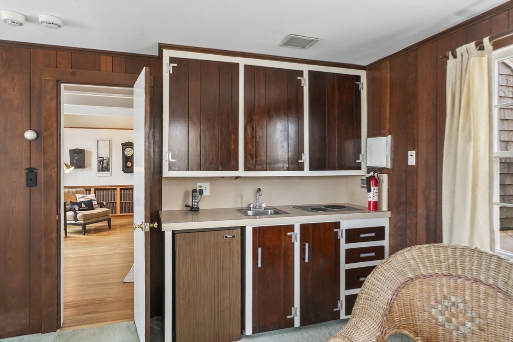 94 Weaver Lane Tisbury, MA 02568 - Photo 20 of 36 a kitchen with a sink a stove and cabinets