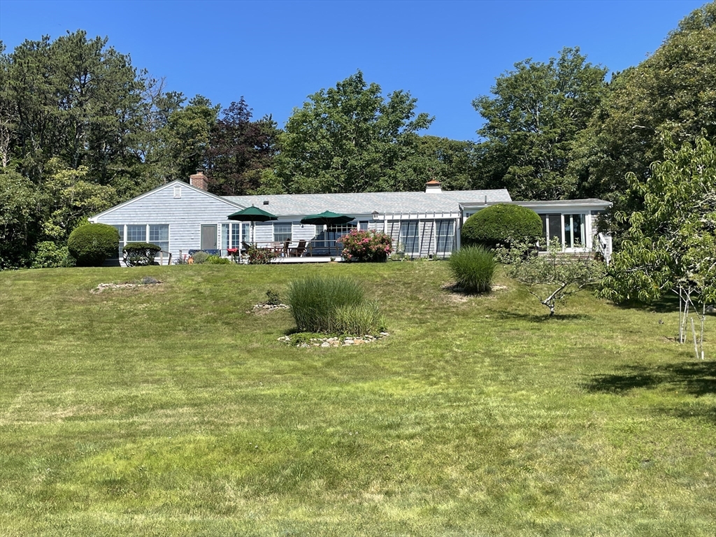 94 Weaver Lane Tisbury, MA 02568 - Photo 2 of 36 a house view with a garden space