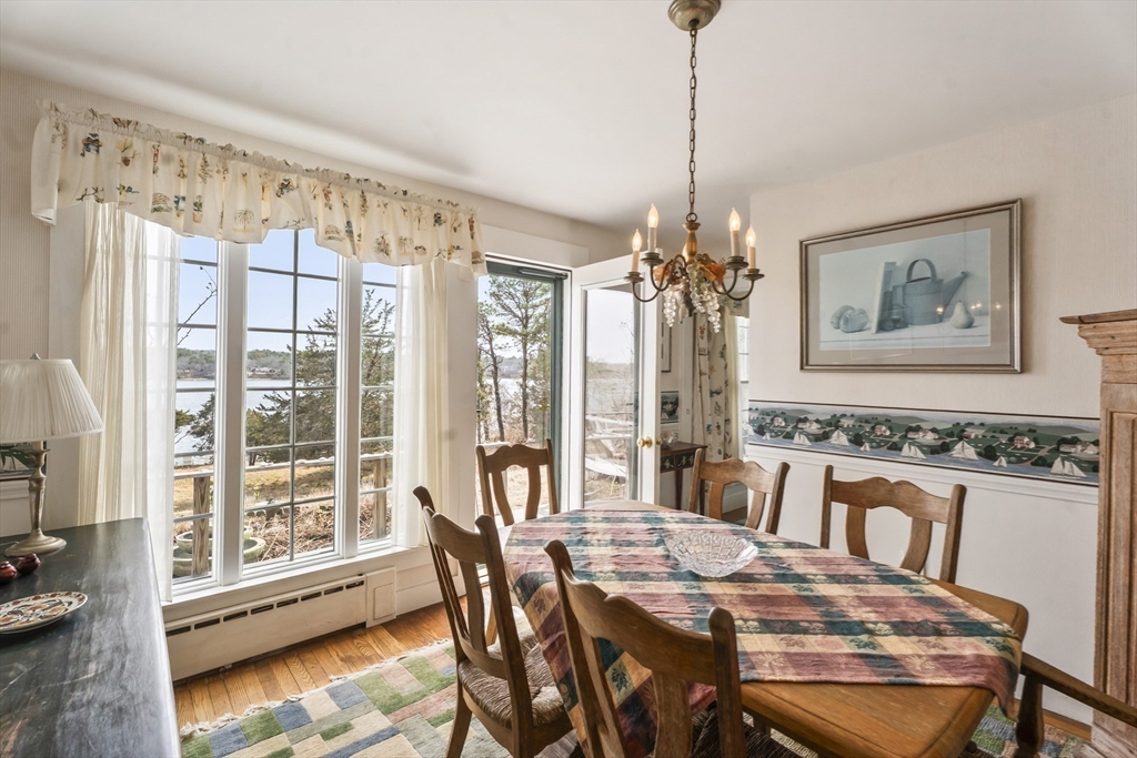 94 Weaver Lane Tisbury, MA 02568 - Photo 22 of 36 a view of a dining room with furniture window and wooden floor