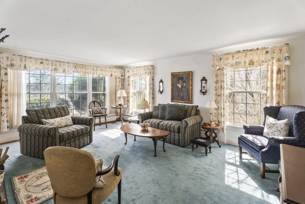 94 Weaver Lane Tisbury, MA 02568 - Photo 23 of 36 a living room with furniture and a large window