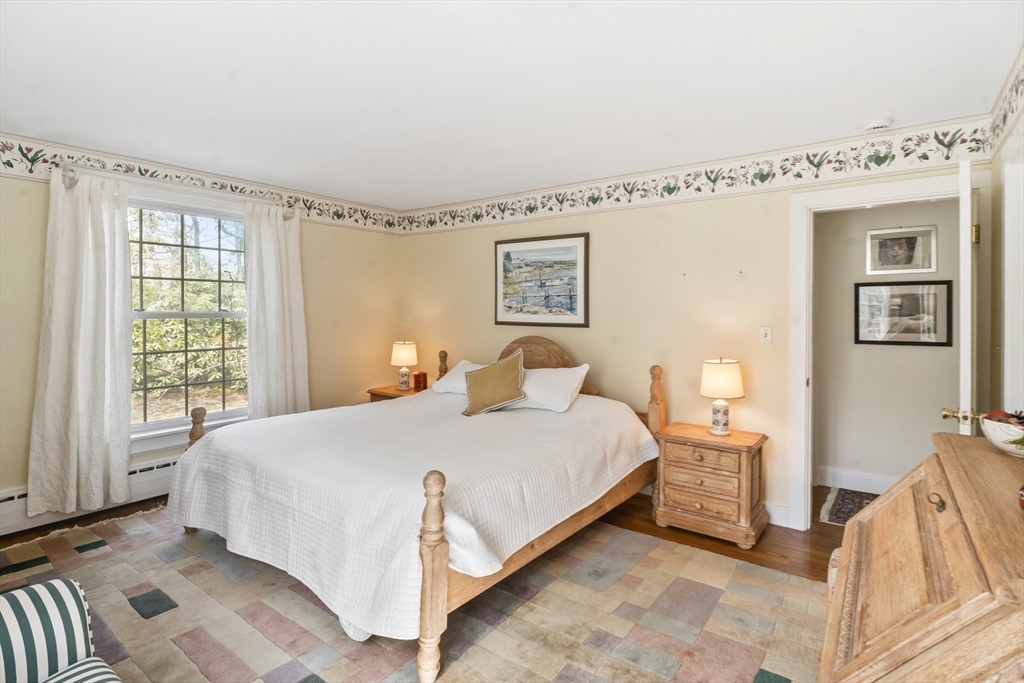 94 Weaver Lane Tisbury, MA 02568 - Photo 26 of 36 a bedroom with a bed and window