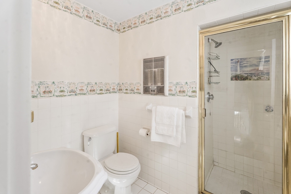 94 Weaver Lane Tisbury, MA 02568 - Photo 28 of 36 a bathroom with a shower a toilet and a sink