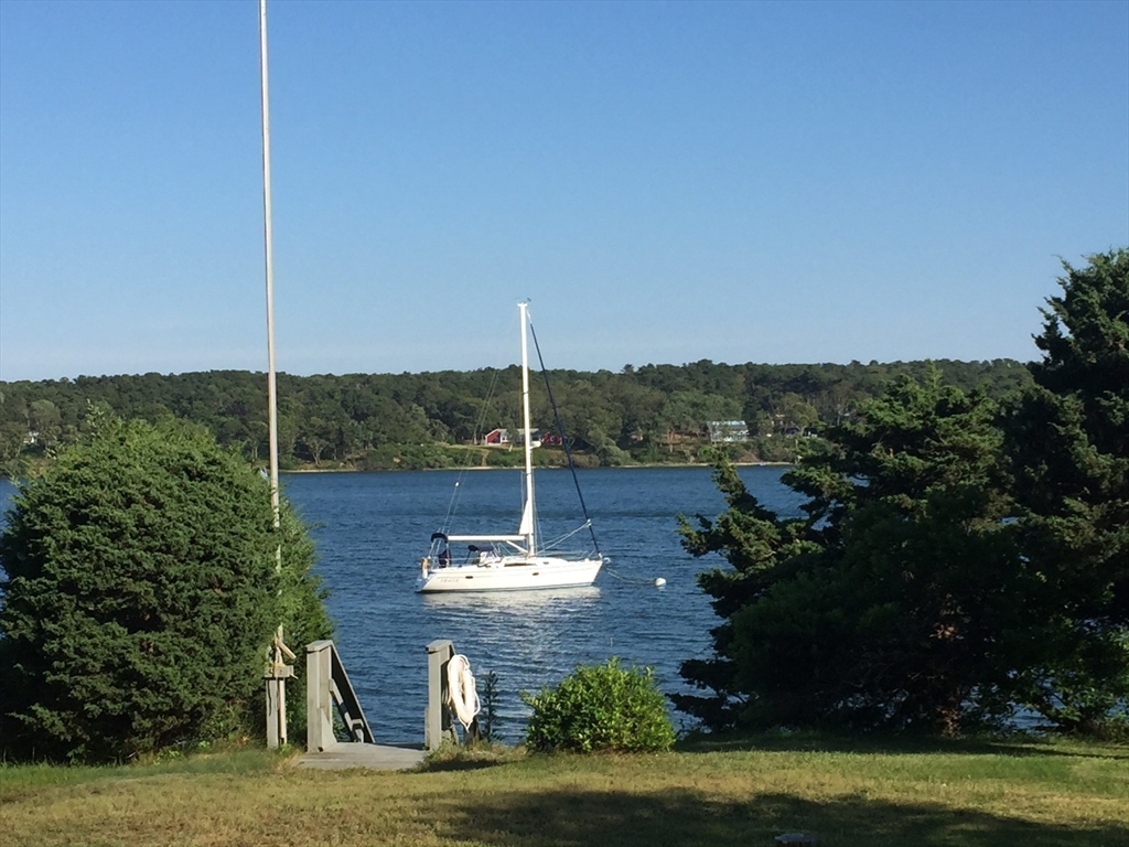 94 Weaver Lane Tisbury, MA 02568 - Photo 5 of 36 a view of a lake with a big yard
