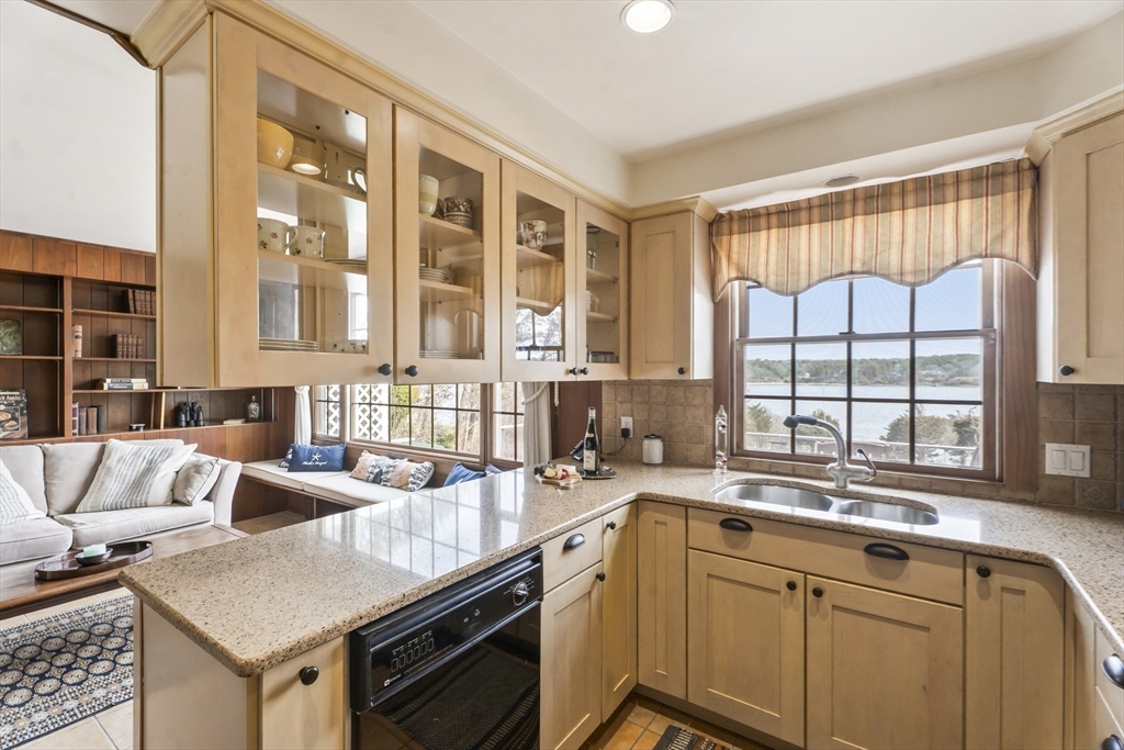 94 Weaver Lane Tisbury, MA 02568 - Photo 10 of 36 a kitchen with a sink and a large window